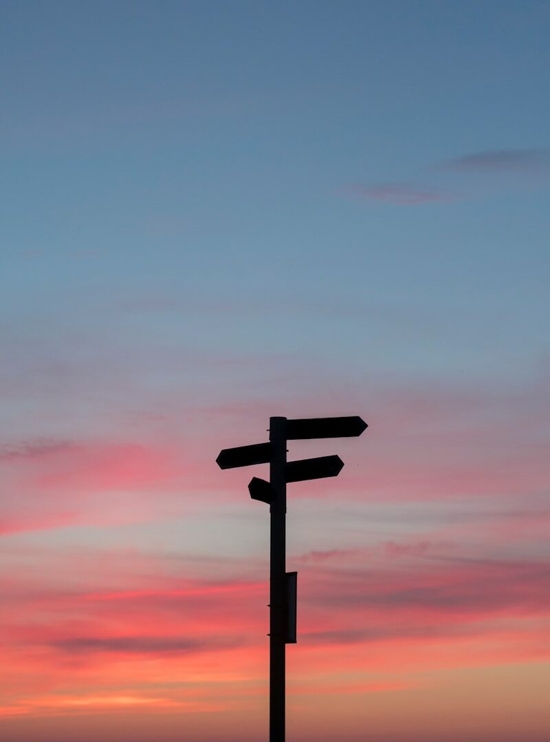 Photo by Javier Allegue Barros silhouette of a road signage during golden hour